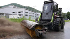 Kovaco angle brush sweeping a yard