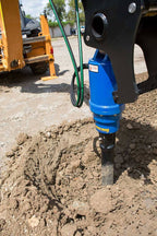 Backhoe loader drilling with an Auger Torque auger