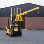 Fork mounted telescopic jib for machinery lifting