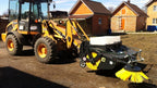 Kovaco sweeper with waste collector fitted to a loader