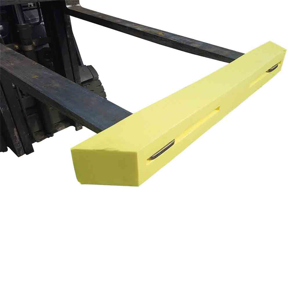 Yellow fork tip highlighter on forklift forks