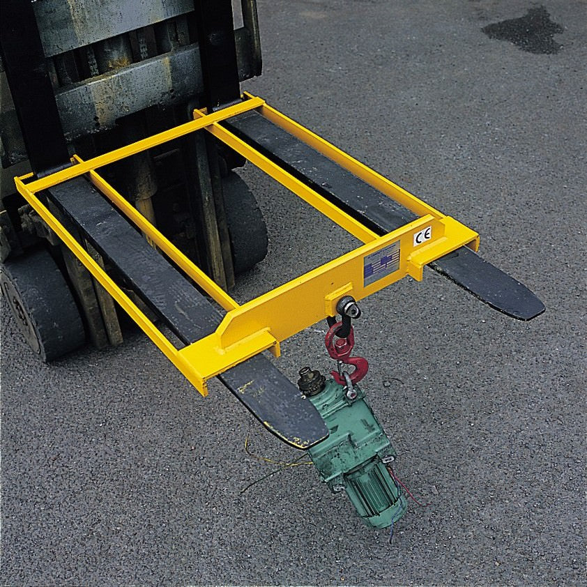 Fixed forklift hook lifting a motor on forklift forks