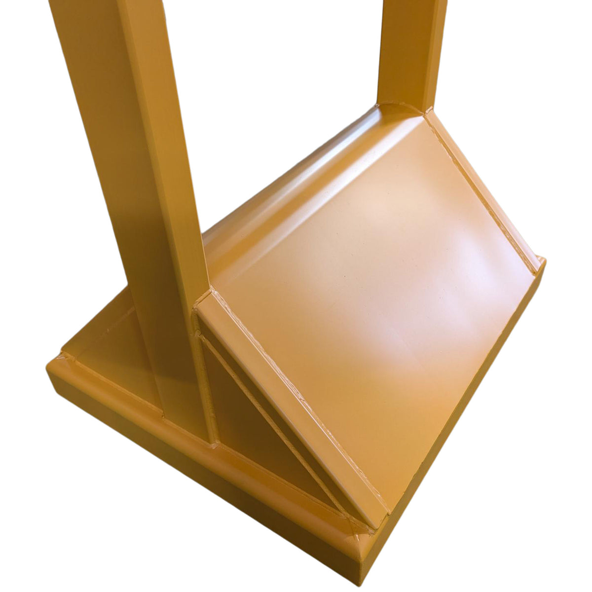Close-up of the skip compactor’s angled compaction plate