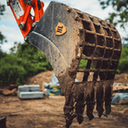 Excavator riddle bucket in use
